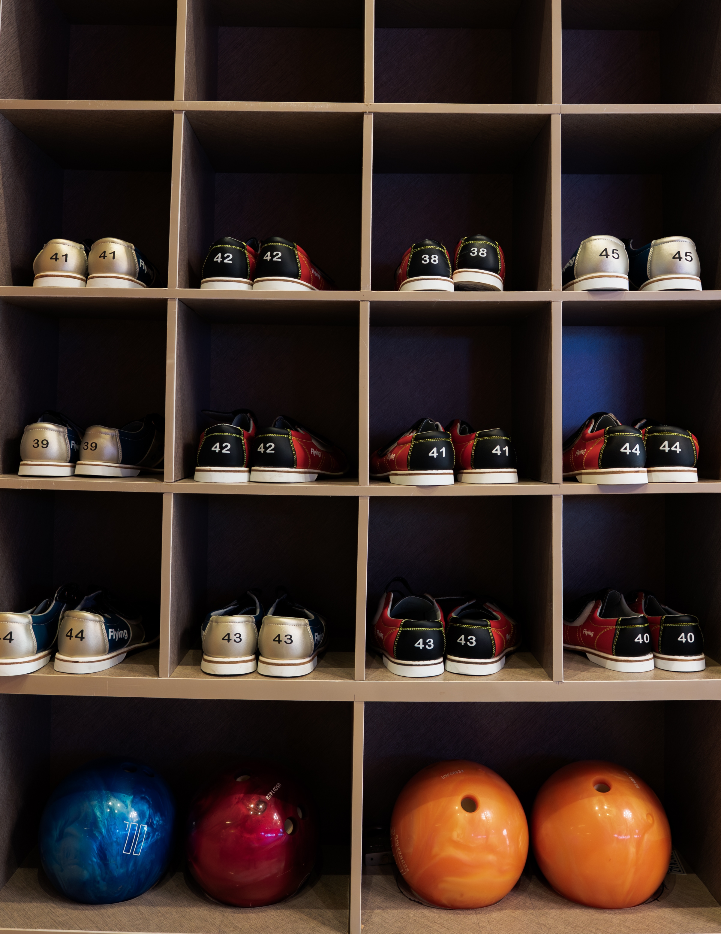 Bowling shoes and balls at the lane