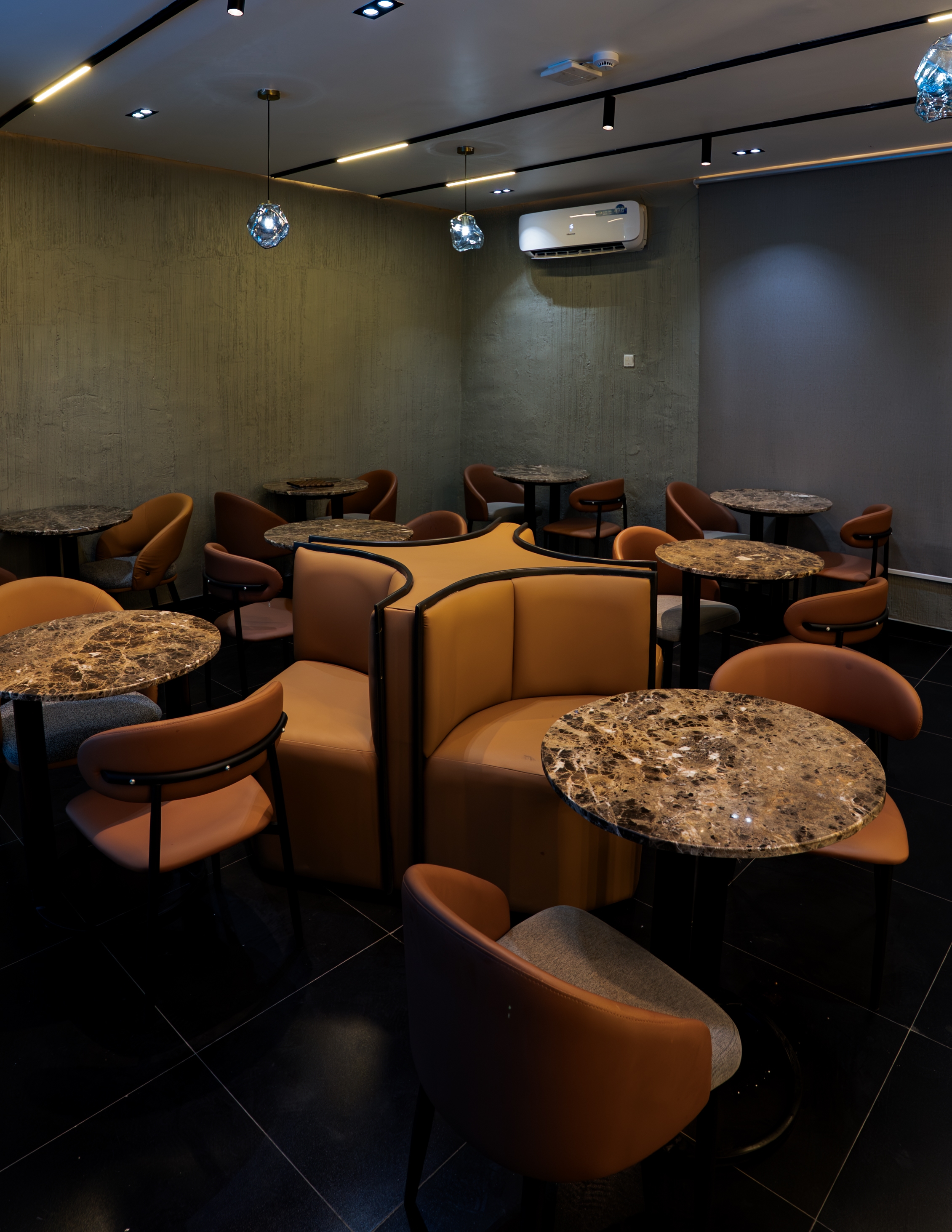 Booth seating in warm, moody light