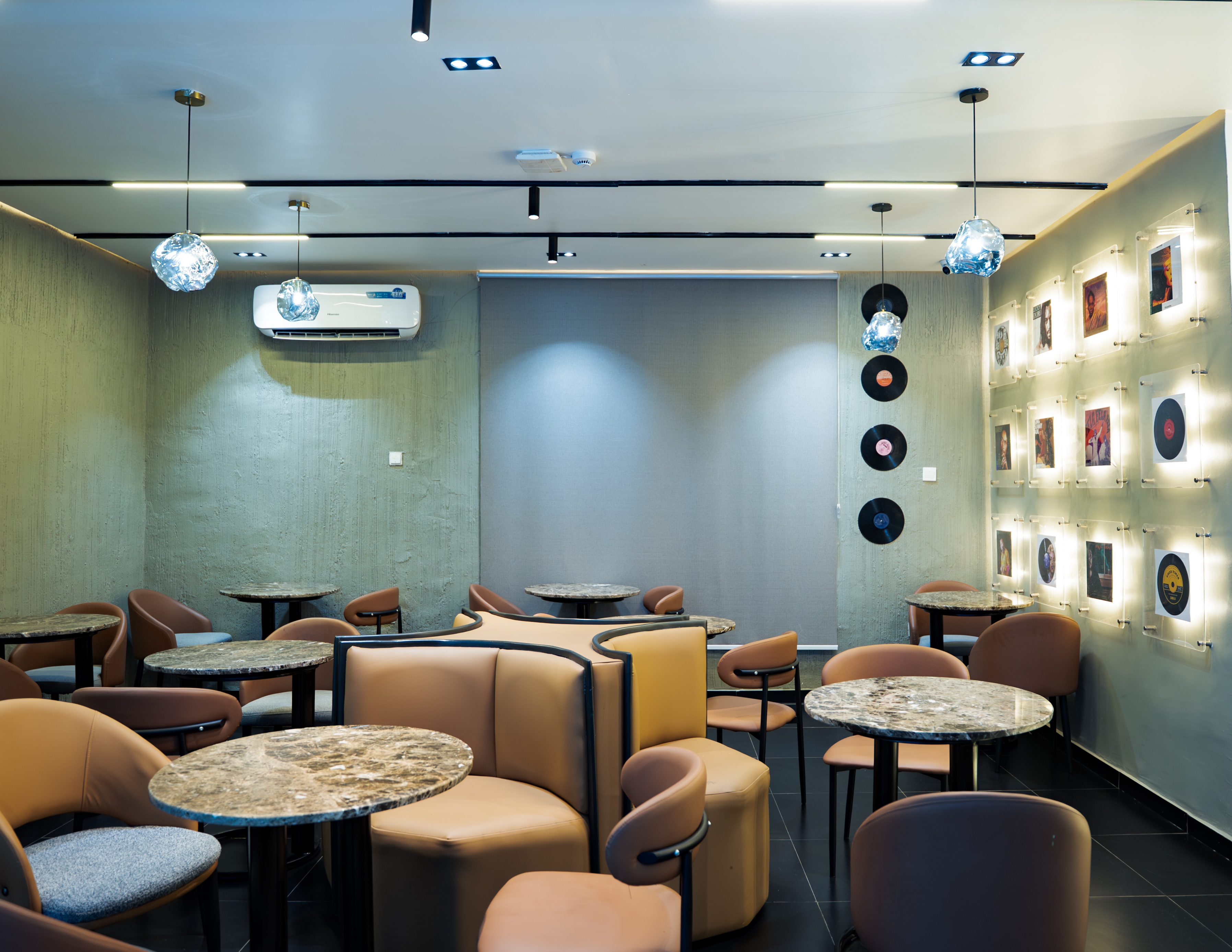 Lounge seating beneath the vinyl record wall
